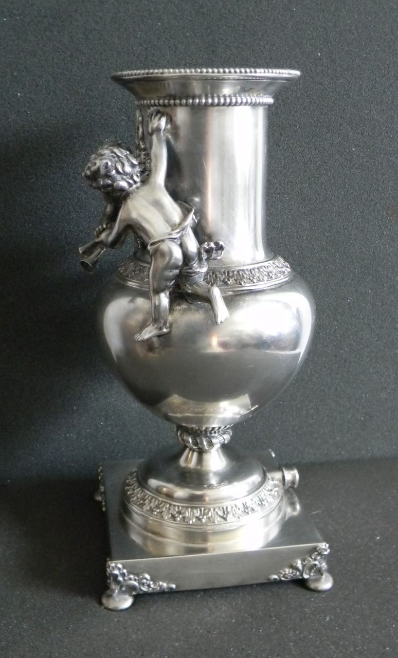 Silver plate vase with cherubs and figure - wind figure Silver plate vase with cherubs and figure - wind figure