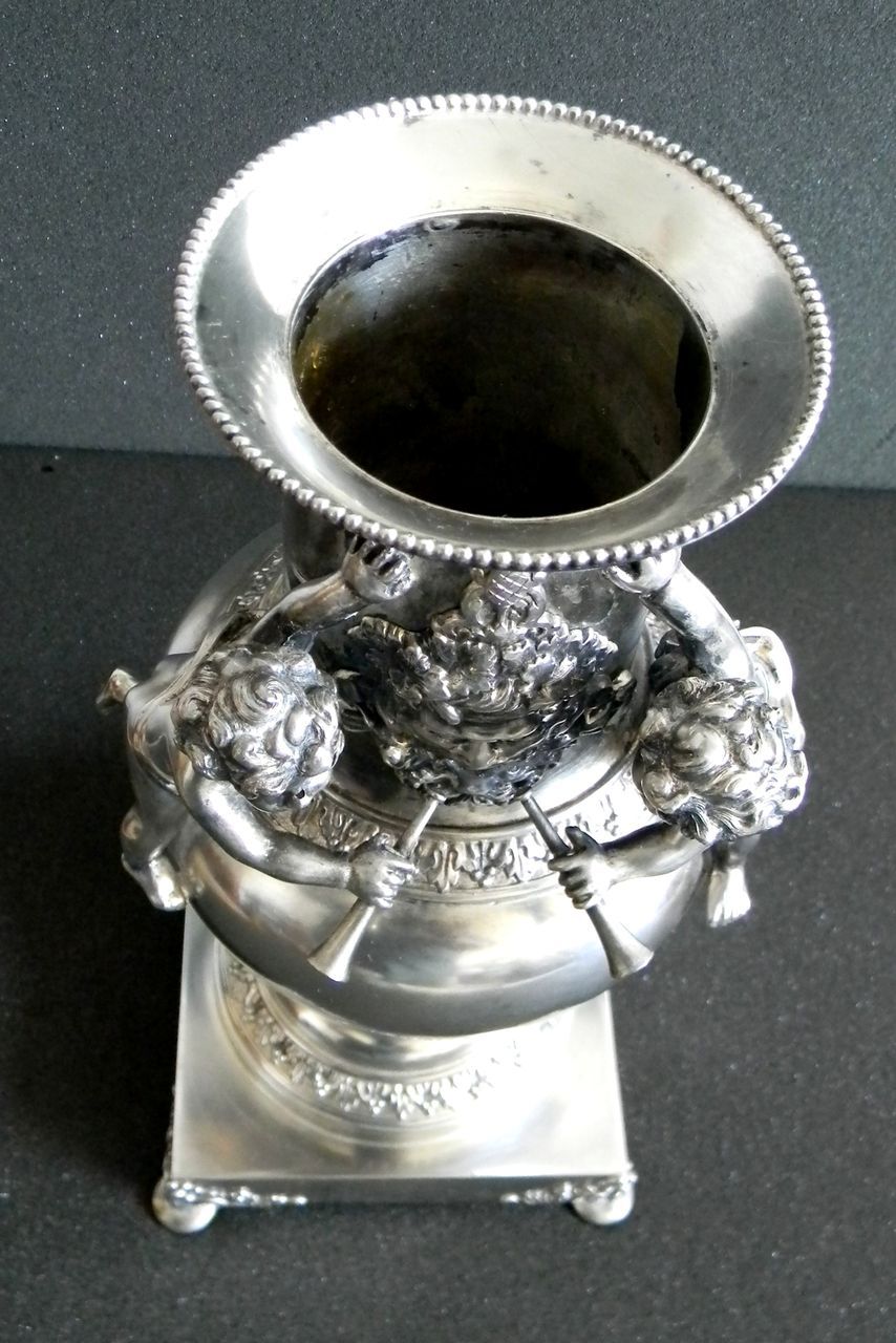 Silver plate vase with cherubs and figure - wind figure Silver plate vase with cherubs and figure - wind figure