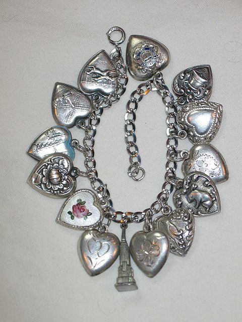 Sterling Silver Puffy Heart Charm with Repousse Bell and Ribbon Engraved 'Grandma L." Sterling Silver Puffy Heart Charm with Repousse Bell and Ribbon Engraved 'Grandma L."