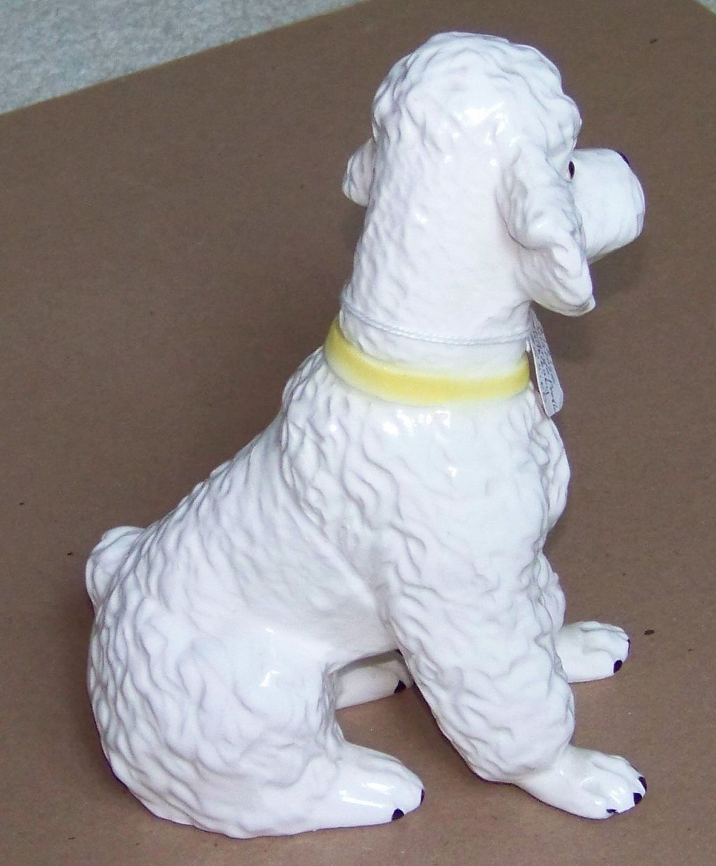 white ceramic poodle