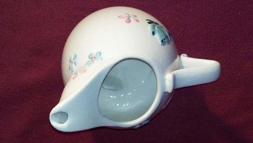 Hull 3 Footed Pitcher with Butterflies Hull 3 Footed Pitcher with Butterflies
