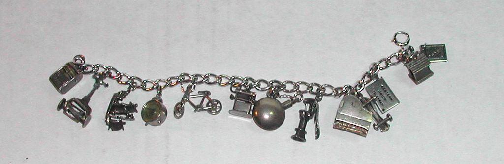 c.1950s Sterling Charm Bracelet Moveable Parts Piano Clock Bicycle etc c.1950s Sterling Charm Bracelet Moveable Parts Piano Clock Bicycle etc