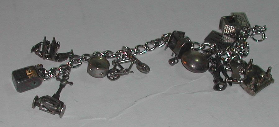 c.1950s Sterling Charm Bracelet Moveable Parts Piano Clock Bicycle etc c.1950s Sterling Charm Bracelet Moveable Parts Piano Clock Bicycle etc