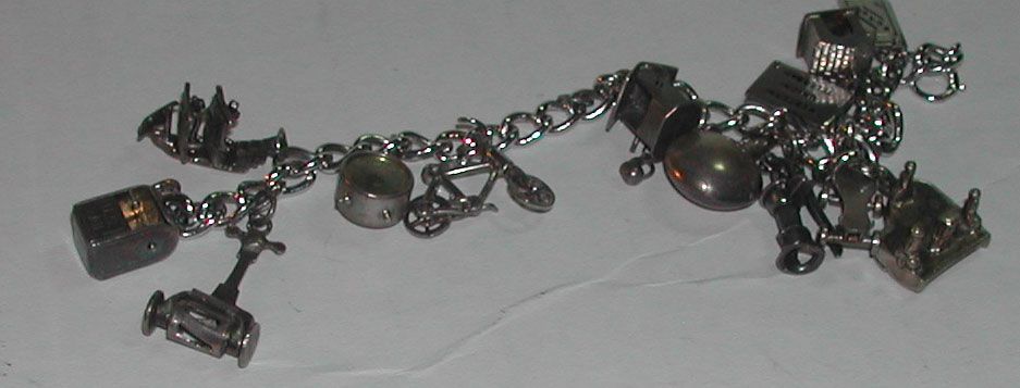 c.1950s Sterling Charm Bracelet Moveable Parts Piano Clock Bicycle etc c.1950s Sterling Charm Bracelet Moveable Parts Piano Clock Bicycle etc