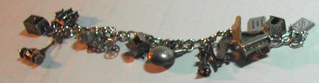 c.1950s Sterling Charm Bracelet Moveable Parts Piano Clock Bicycle etc c.1950s Sterling Charm Bracelet Moveable Parts Piano Clock Bicycle etc