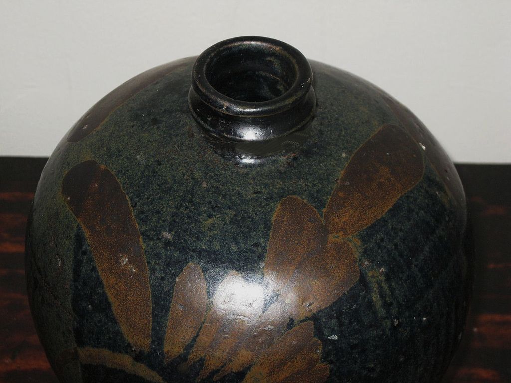 Chinese Henan Pottery Black-Glazed Vase with Rust Floral Motif Chinese Henan Pottery Black-Glazed Vase with Rust Floral Motif