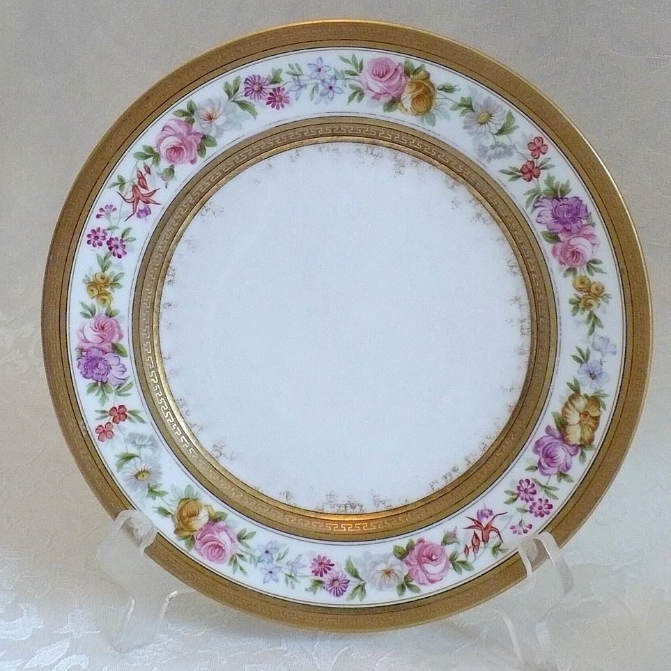 Limoges Porcelain Plate with Floral Pattern and Extensive Gold Borders Limoges Porcelain Plate with Floral Pattern and Extensive Gold Borders