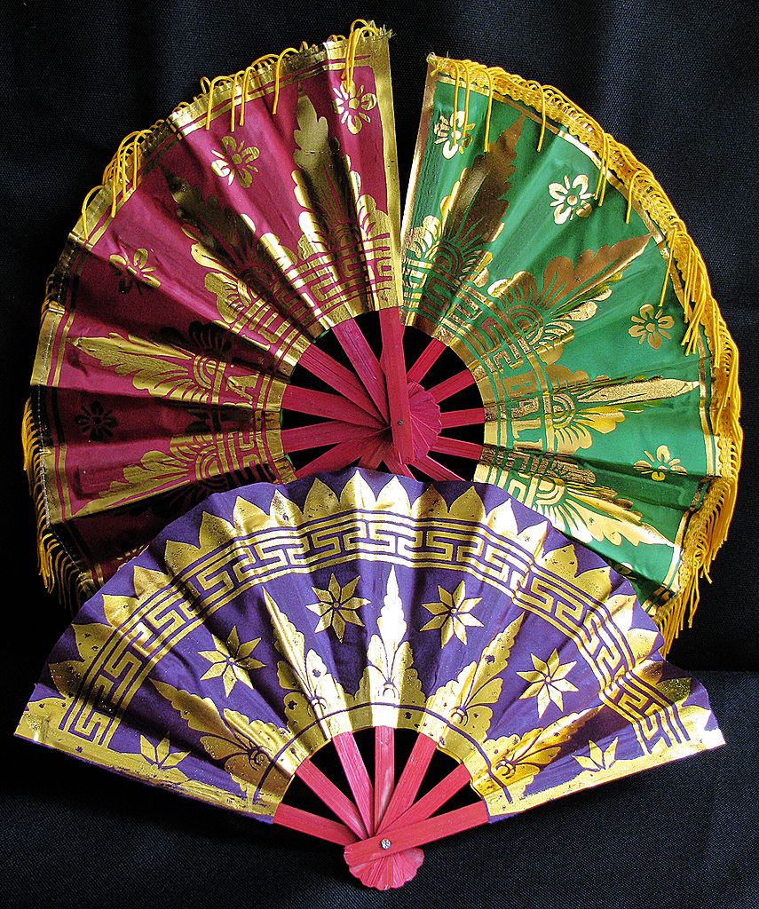 Cloth Fans Silk Screened With Golden Balinese Motifs And Fringe Cloth Fans Silk Screened With Golden Balinese Motifs And Fringe