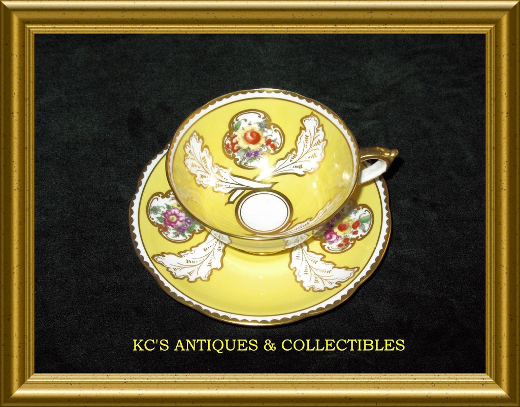 Paragon Fine Bone China (England) Cup & Saucer in a yellow glaze made for William Junor (Toronto, Canada) Paragon Fine Bone China (England) Cup & Saucer in a yellow glaze made for William Junor (Toronto, Canada)