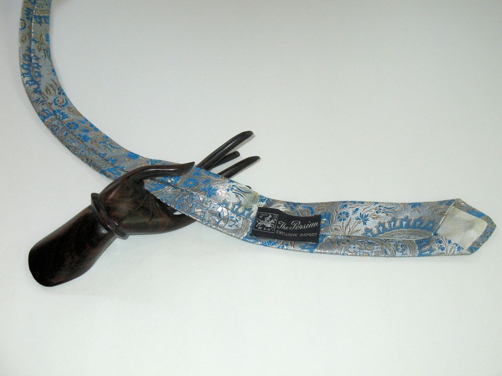 Vintage Silk Brocade Necktie, silver color with turquoise and metallic gold décor. Vintage Silk Brocade Necktie, silver color with turquoise and metallic gold décor.