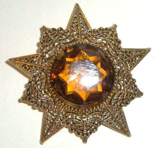 ART Goldtone Starburst Pin with Amber Rhinestone Center ART Goldtone Starburst Pin with Amber Rhinestone Center