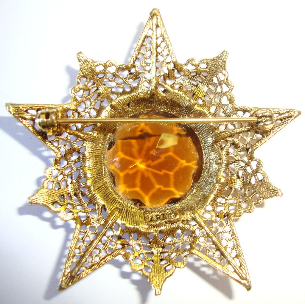 ART Goldtone Starburst Pin with Amber Rhinestone Center ART Goldtone Starburst Pin with Amber Rhinestone Center