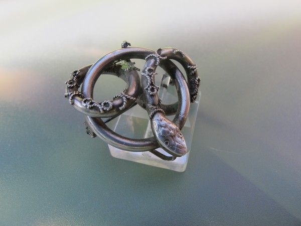 Antique silver brooch depicting a twisted snake, early 19th century Antique silver brooch depicting a twisted snake, early 19th century