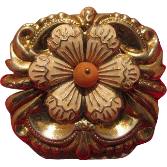Gilded silver brooch with a white enamel flower and a Coral in the center Gilded silver brooch with a white enamel flower and a Coral in the center