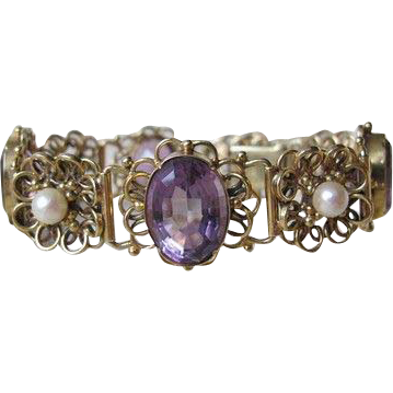 Fourteen karat yellow gold bracelet adorned with Amethysts and cultured pearls Fourteen karat yellow gold bracelet adorned with Amethysts and cultured pearls