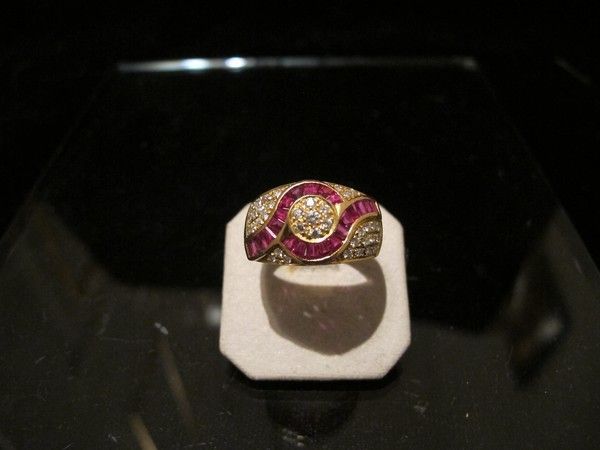 A Ruby and Diamond ring set in fourteen karat yellow gold A Ruby and Diamond ring set in fourteen karat yellow gold