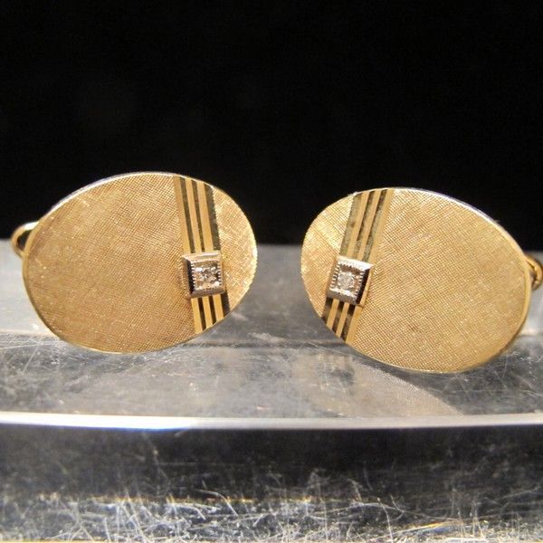 Fourteen karat yellow gold cuff links with a little Diamond Fourteen karat yellow gold cuff links with a little Diamond