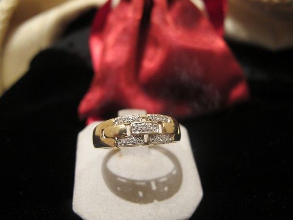 Fourteen karat yellow gold and diamond ring, dated at about 1960 Fourteen karat yellow gold and diamond ring, dated at about 1960