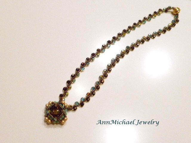 Handwoven Turquoise Blue and Bronze Crystal Pendant/Necklace Handwoven Turquoise Blue and Bronze Crystal Pendant/Necklace