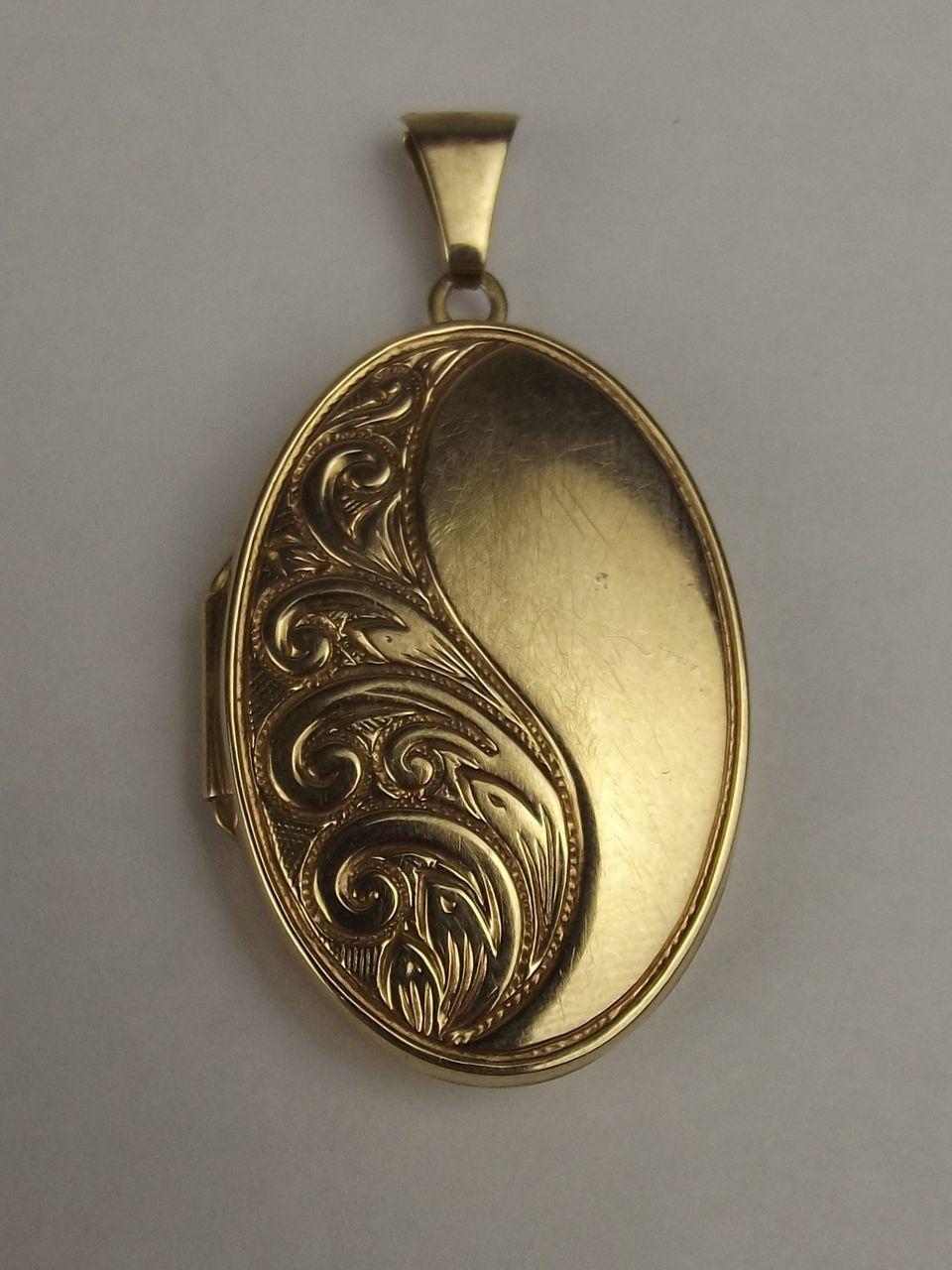 9ct yellow gold oval engraved locket pendant from 9ct yellow gold oval engraved locket pendant from