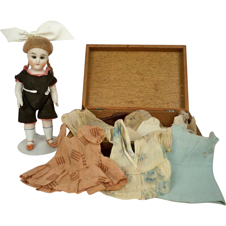 German Bisque 7 inch, 10-piece Wardrobe and Box. Shoulder Head 6343 German Bisque 7 inch, 10-piece Wardrobe and Box. Shoulder Head 6343