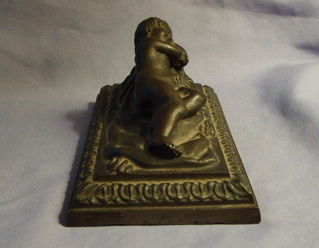 19th Century Putti Cherub Child Reclining On Lion Bronzed Metal Sculpture 19th Century Putti Cherub Child Reclining On Lion Bronzed Metal Sculpture