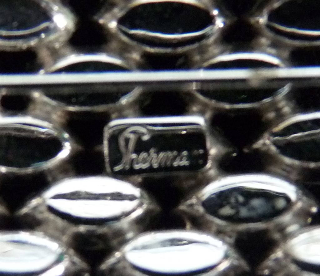 Clear and Hematite Signed Sherman Pin Clear and Hematite Signed Sherman Pin