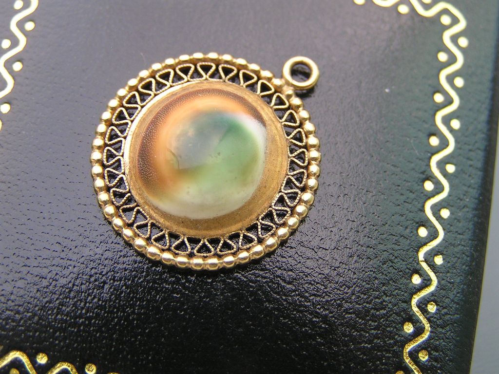 Vintage 10kt solid yellow Gold Operculum Shell Charm for Bracelet Vintage 10kt solid yellow Gold Operculum Shell Charm for Bracelet
