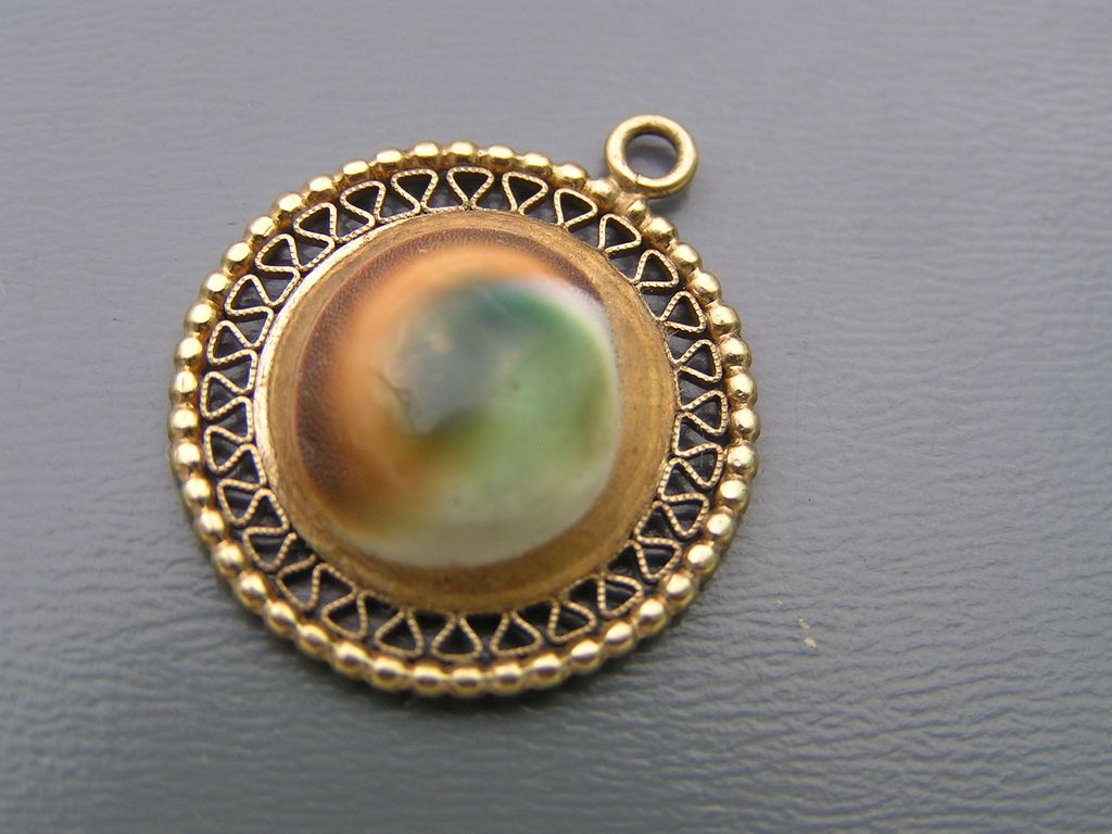 Vintage 10kt solid yellow Gold Operculum Shell Charm for Bracelet Vintage 10kt solid yellow Gold Operculum Shell Charm for Bracelet