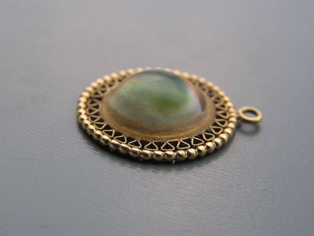 Vintage 10kt solid yellow Gold Operculum Shell Charm for Bracelet Vintage 10kt solid yellow Gold Operculum Shell Charm for Bracelet