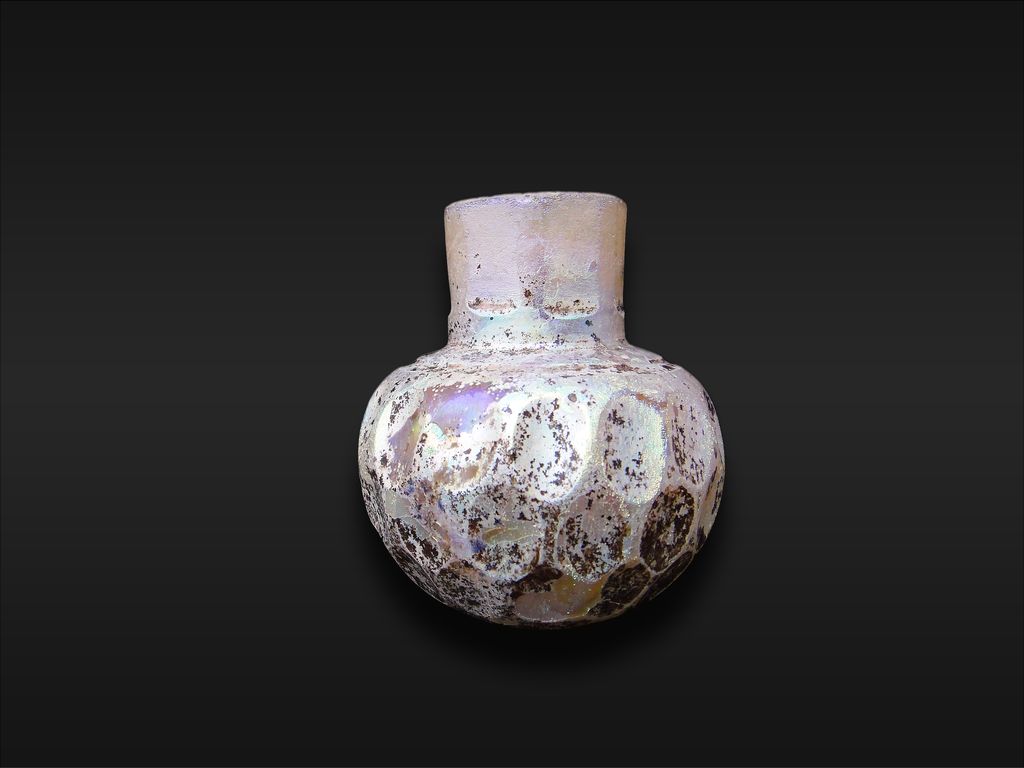 A Wheel-cut white glass bottle 9th Century A Wheel-cut white glass bottle 9th Century