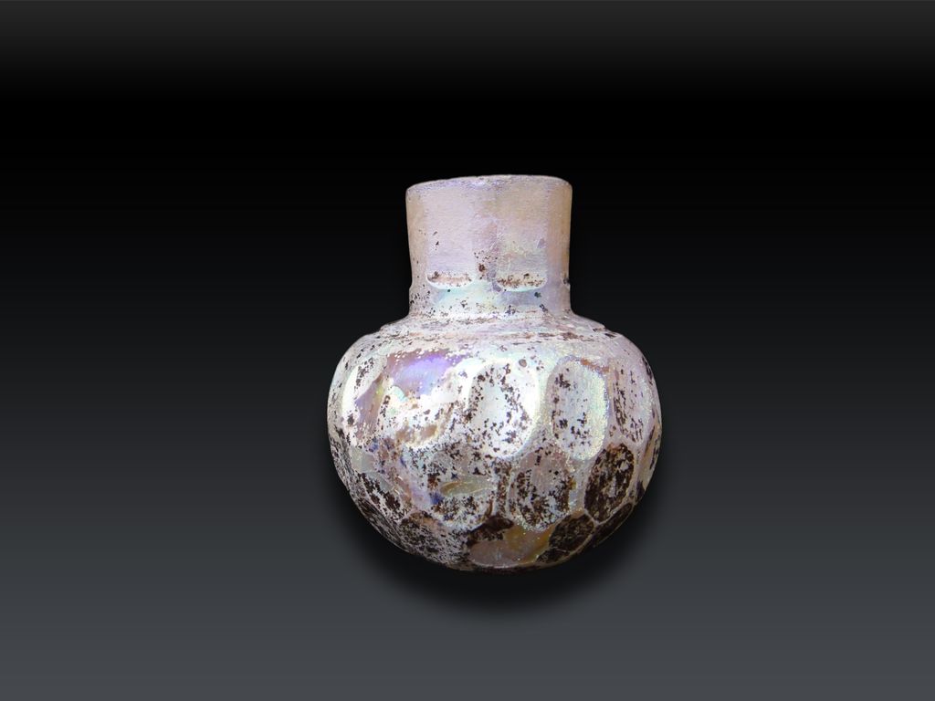 A Wheel-cut white glass bottle 9th Century A Wheel-cut white glass bottle 9th Century