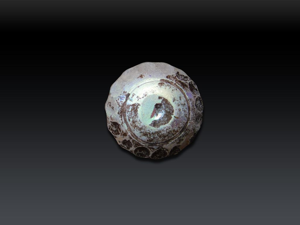 A Wheel-cut white glass bottle 9th Century A Wheel-cut white glass bottle 9th Century