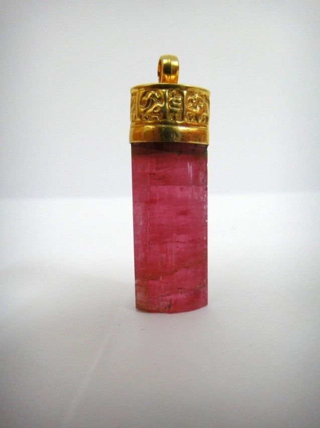 A Seljuke Kufic Inscribed Pink-Tourmaline Pendant 12th Century A Seljuke Kufic Inscribed Pink-Tourmaline Pendant 12th Century
