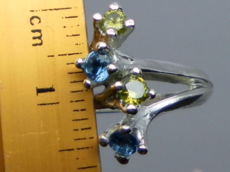 NATURAL peridot and blue topaz silver ring; all sizes from 3 to 13. NATURAL peridot and blue topaz silver ring; all sizes from 3 to 13.