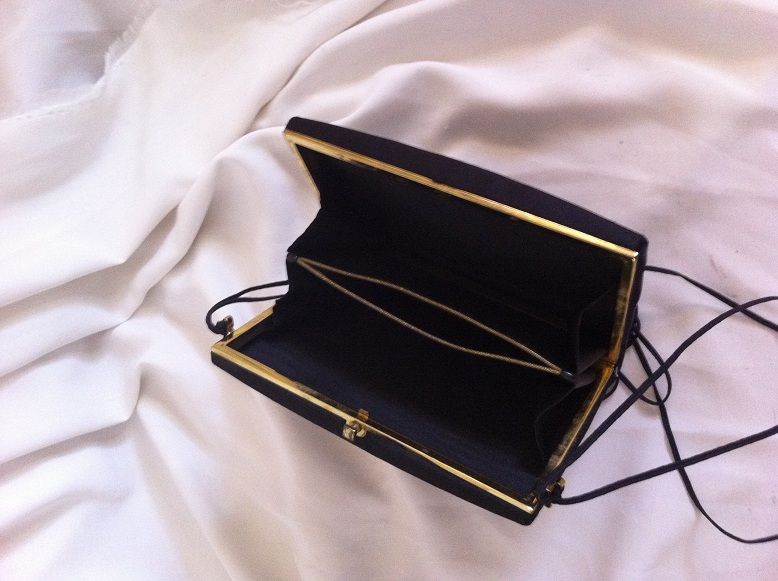 Black satin vintage woman's purse compact with embroidered flower. Black satin vintage woman's purse compact with embroidered flower.