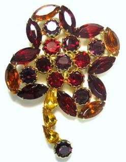 Vintage Four Petal Flower Brooch with Multi Shaped Rhinestones in Red, Purple, Amber and Gold Vintage Four Petal Flower Brooch with Multi Shaped Rhinestones in Red, Purple, Amber and Gold
