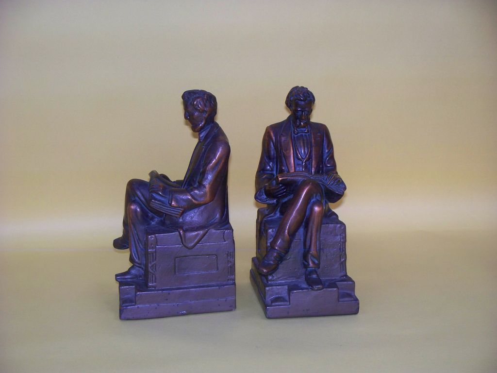 A pair of heavy Abe lincoln clad bookends A pair of heavy Abe lincoln clad bookends