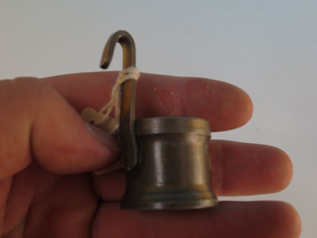 A miniature Pewter measure A miniature Pewter measure