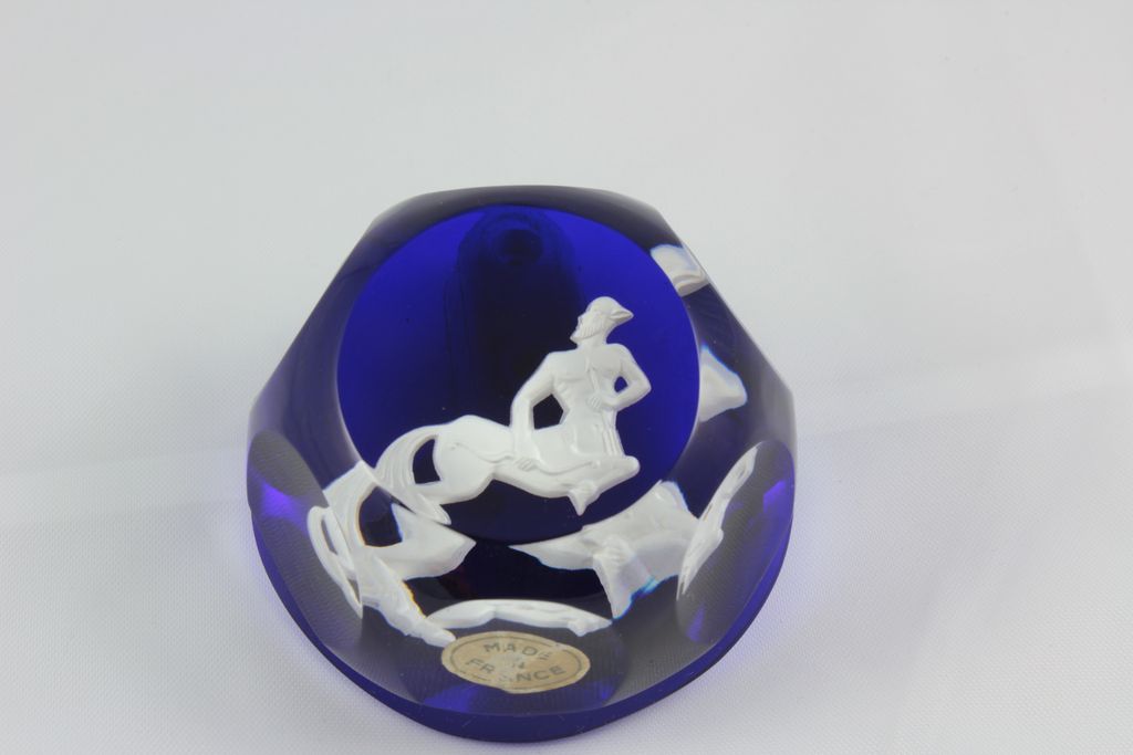 Baccarat Paper Weights infused with Cobalt Blue showing a white cameo of the symbol Sagittarius Baccarat Paper Weights infused with Cobalt Blue showing a white cameo of the symbol Sagittarius