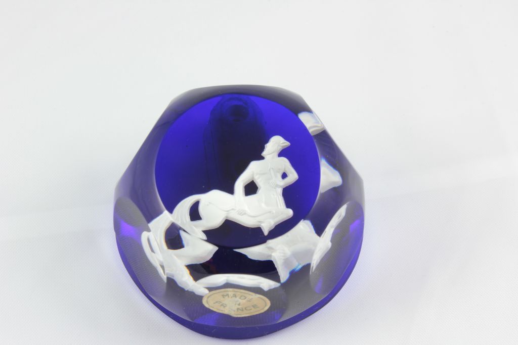Baccarat Paper Weights infused with Cobalt Blue showing a white cameo of the symbol Sagittarius Baccarat Paper Weights infused with Cobalt Blue showing a white cameo of the symbol Sagittarius
