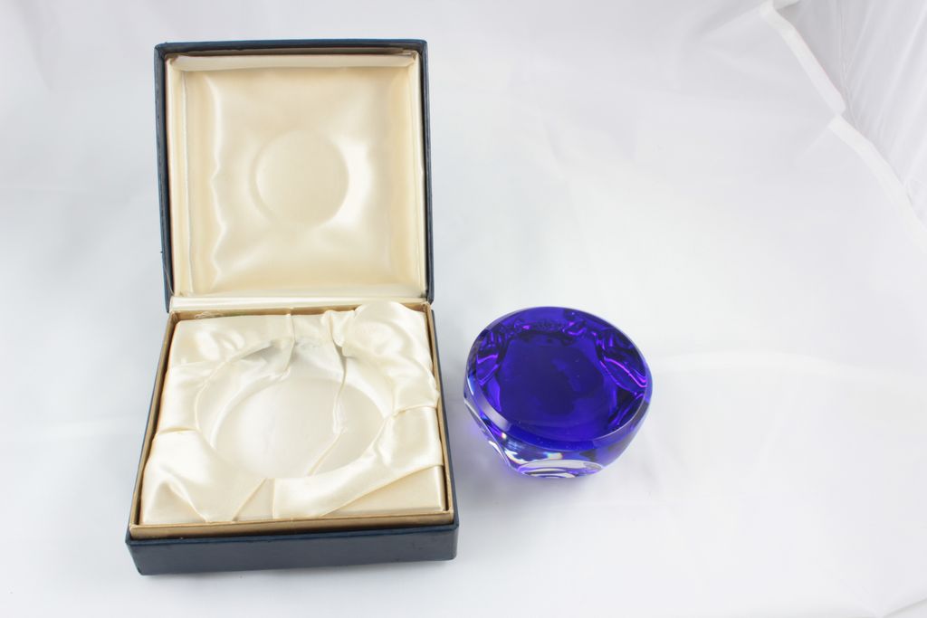 Baccarat Paper Weights infused with Cobalt Blue showing a white cameo of the symbol Sagittarius Baccarat Paper Weights infused with Cobalt Blue showing a white cameo of the symbol Sagittarius