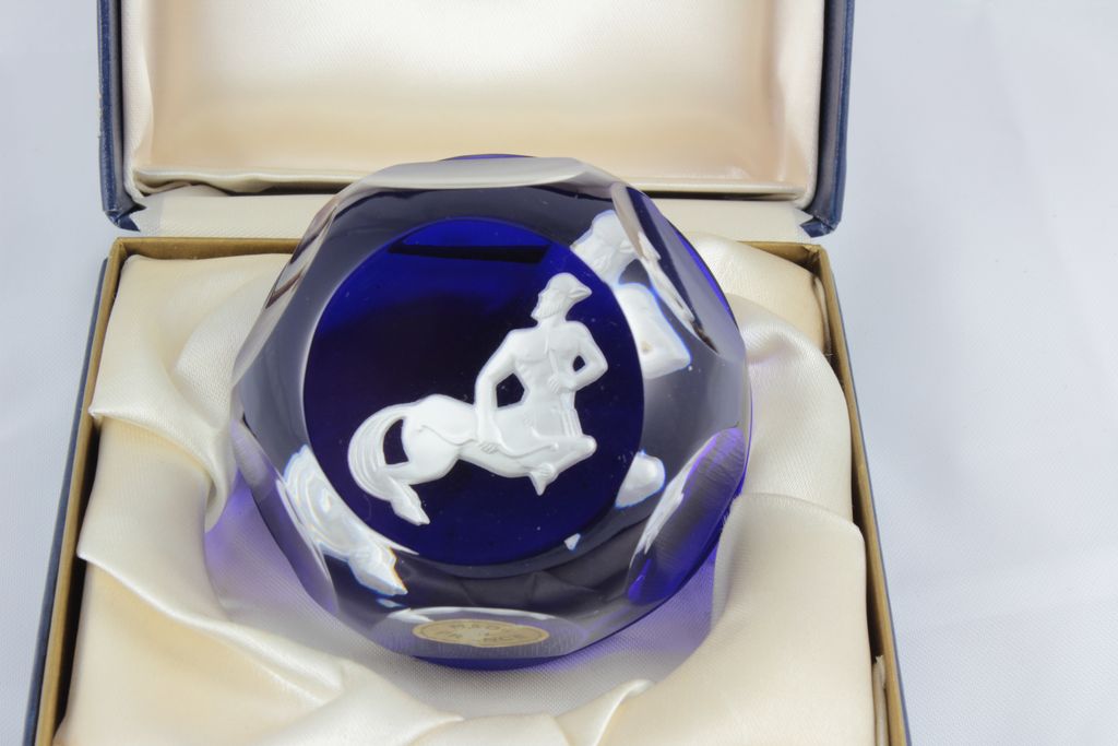 Baccarat Paper Weights infused with Cobalt Blue showing a white cameo of the symbol Sagittarius Baccarat Paper Weights infused with Cobalt Blue showing a white cameo of the symbol Sagittarius