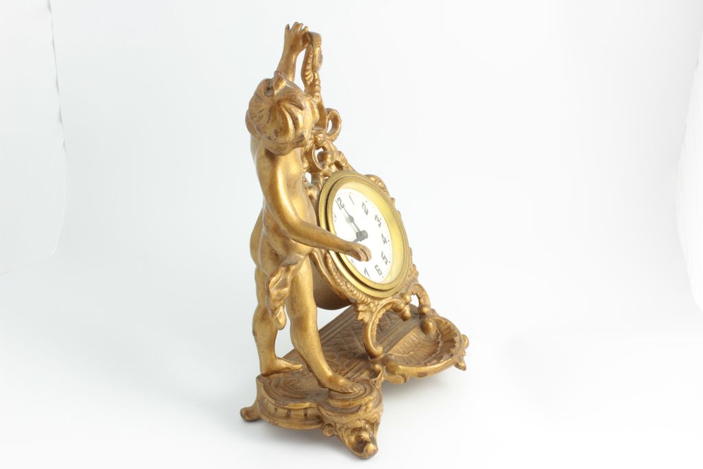 Desk Clock With Cherub, Clock Features A German Movement. Desk Clock With Cherub, Clock Features A German Movement.
