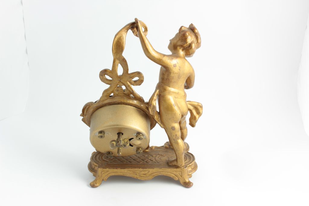 Desk Clock With Cherub, Clock Features A German Movement. Desk Clock With Cherub, Clock Features A German Movement.
