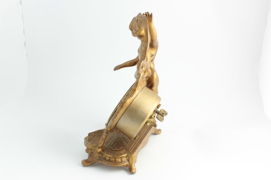 Desk Clock With Cherub, Clock Features A German Movement. Desk Clock With Cherub, Clock Features A German Movement.
