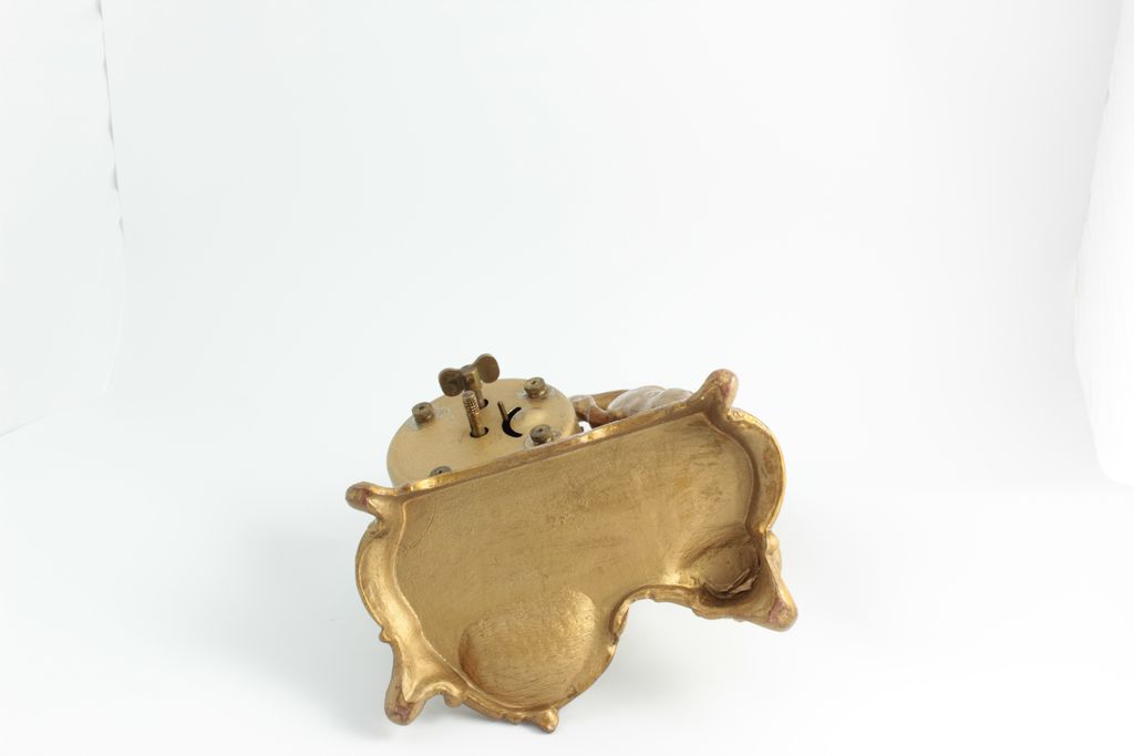 Desk Clock With Cherub, Clock Features A German Movement. Desk Clock With Cherub, Clock Features A German Movement.