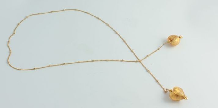 Olivia Stuard Lariat Necklace with Murano glass hearts infused with 24 kt gold Olivia Stuard Lariat Necklace with Murano glass hearts infused with 24 kt gold