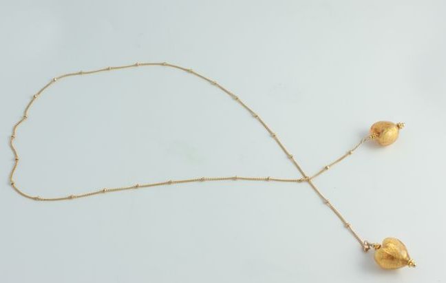 Olivia Stuard Lariat Necklace with Murano glass hearts infused with 24 kt gold Olivia Stuard Lariat Necklace with Murano glass hearts infused with 24 kt gold