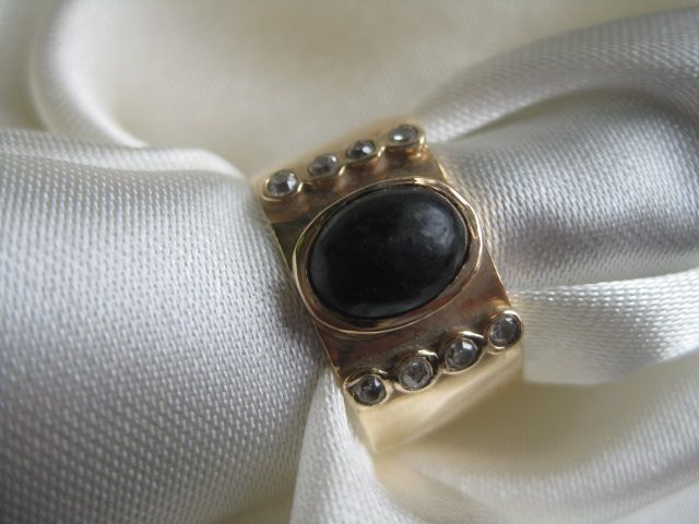Gold Band with Black Onyx Cabachon and Diamonds Gold Band with Black Onyx Cabachon and Diamonds